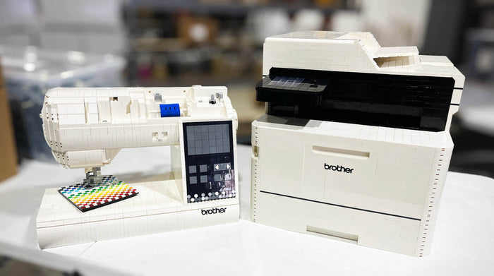 Large scale brick models of a Brother sewing machine and printer