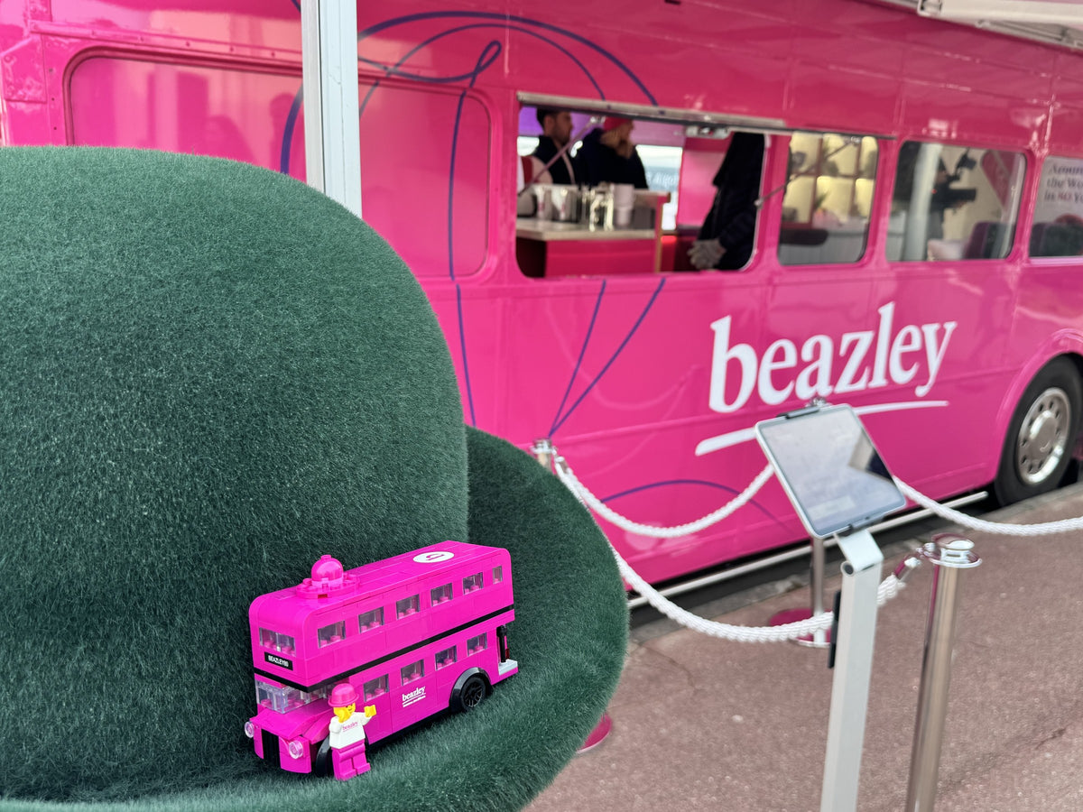 Beazley Bowler Bus Building Kit, the assembled model with the full-size Beazley bus behind it