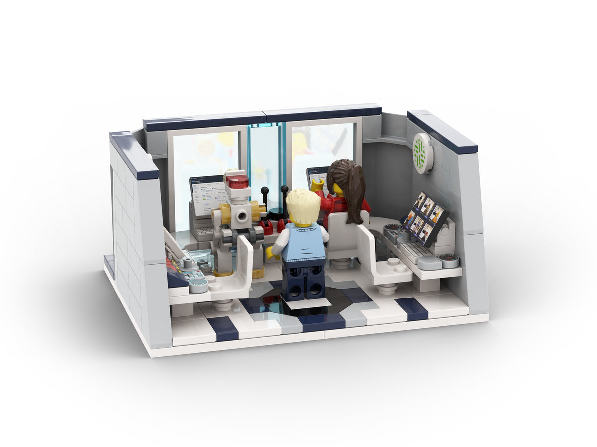 Open Collibra control room with people, workstations and screens.